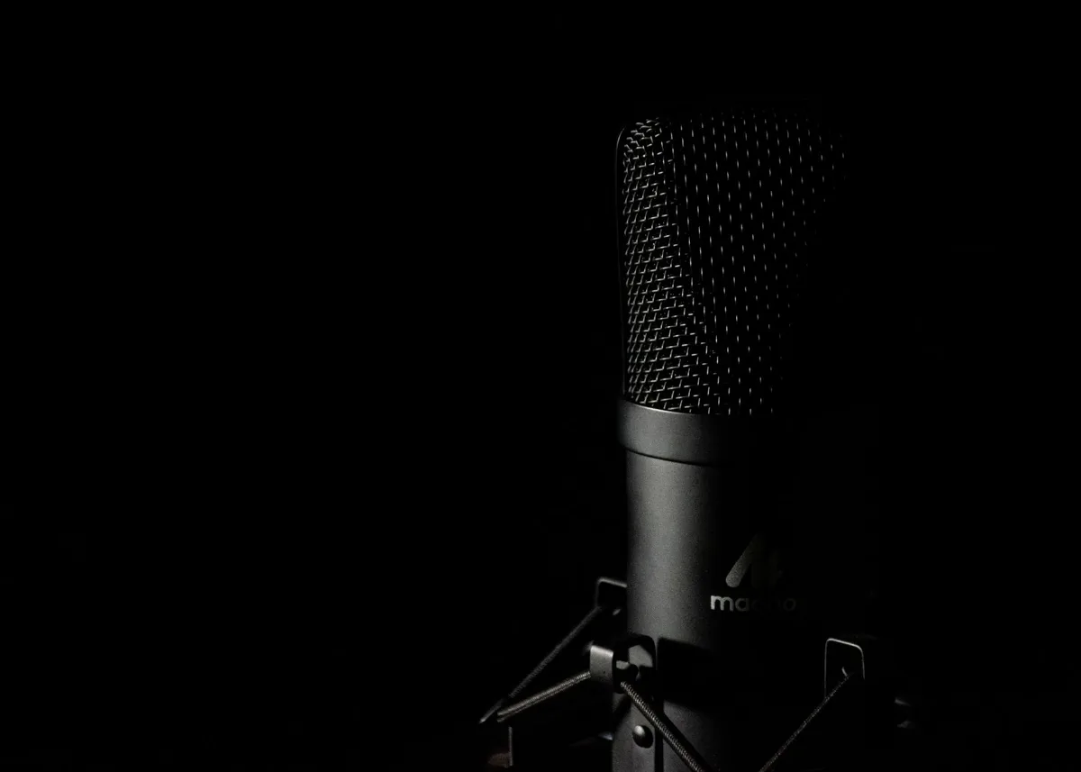 Podcast recording studio setup with microphone and headphones