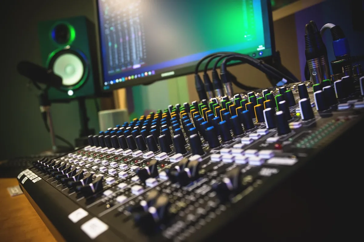 Control room monitors and mixing desk symbolising channel closures