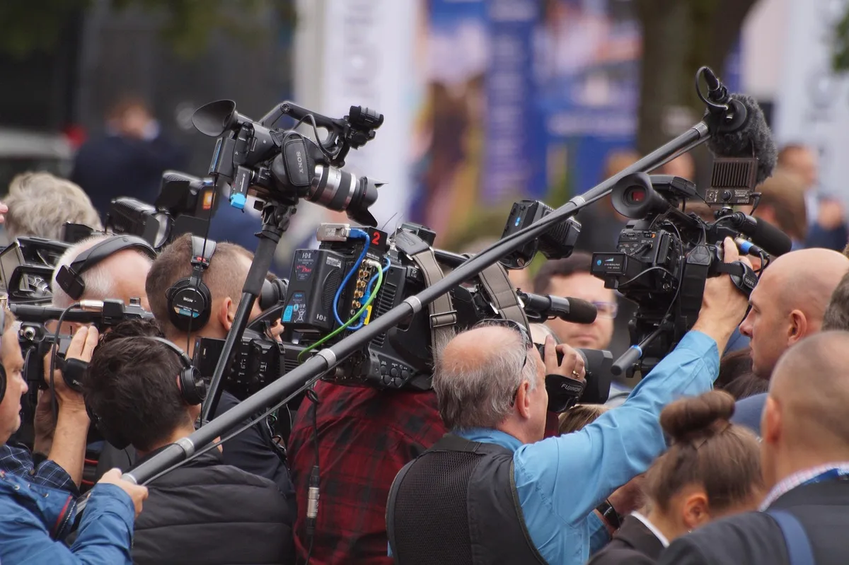 TV pool cameras and crews on the tarmac as press coverage resumes